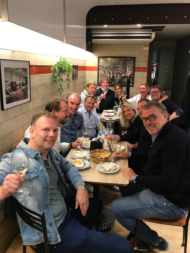 A group enjoying pintxos in a bar in th eold town of San Sebastian